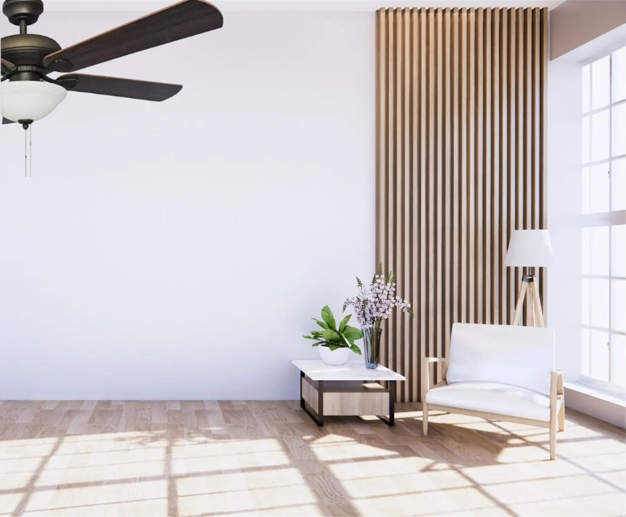 Bright, minimal living room with a dark ceiling fan, a white armchair and a tall window